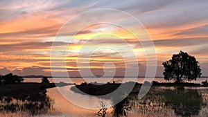 Red purple cloudscape time lapse Sunset lake background Dark red.Â cloud storm.